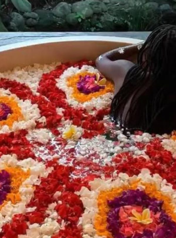 swim in flower petals in Bali with travel gen
